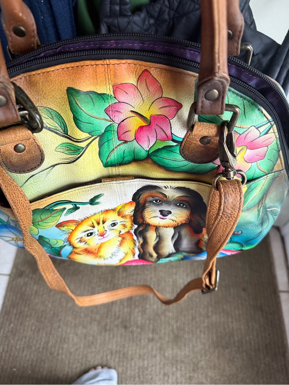 Authetic and  unique Anuschka bag. It’s 13.5 across and 12.5 inches long.